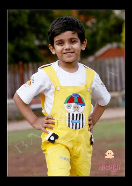 Cute Boy in a Yellow Dangari posing for Camera