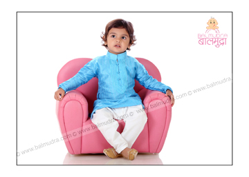 Baby sitting on a Sofa